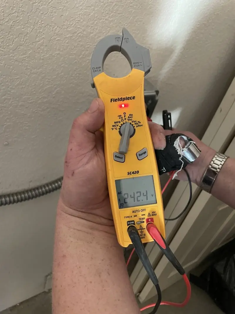 Voltage testing with clamp meter during Outlet Installation in Rye